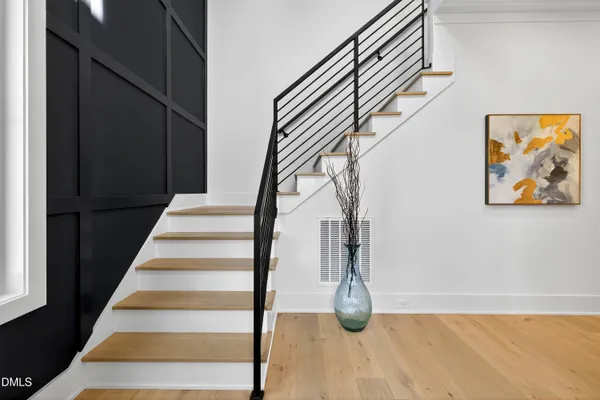 a kitchen with kitchen island granite countertop a sink counter top space and stainless steel appliances
