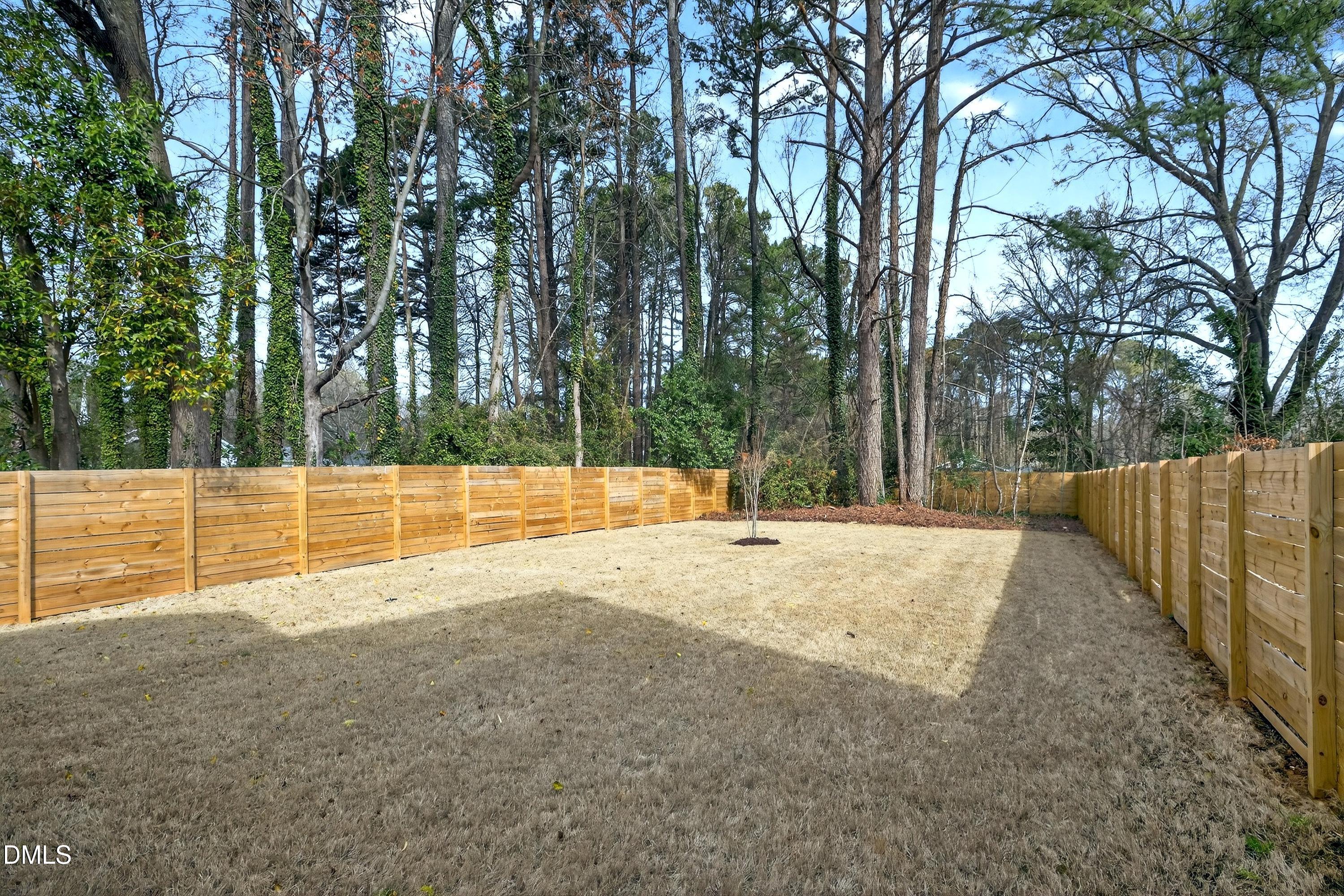 113 Boyd Street Cary, NC 27513 - Photo 63 of 88 a view of a backyard with wooden fence