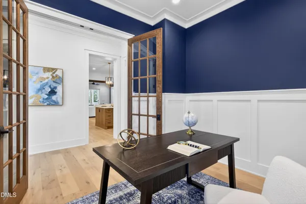 a large kitchen with a table and chairs
