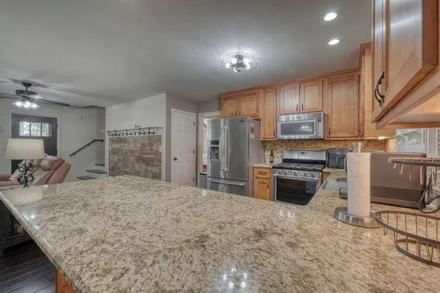 a bed room with a bed and a chandelier