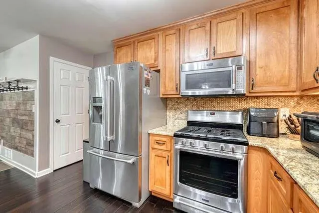 a bathroom with a bathtub and a window