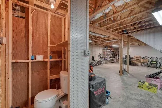 a living room with a floor to ceiling window and a table
