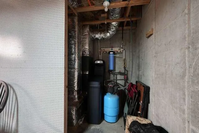 a view of a city with lush green forest