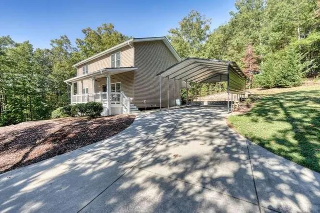 a view of a green field with lots of bushes