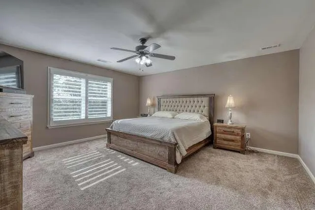 a backyard of a house with yard and outdoor seating