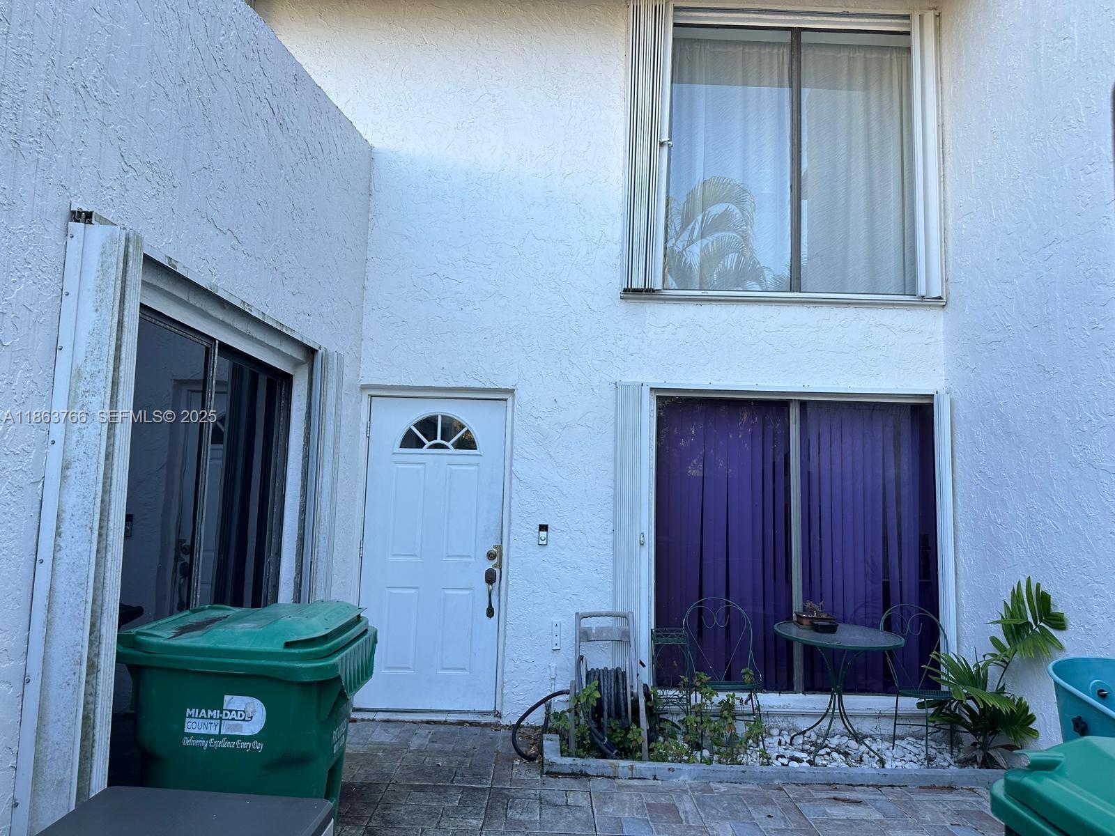 11208 Southwest 67th Terrace Miami, FL 33173 - Photo 14 of 33 a front view of a house with entryway