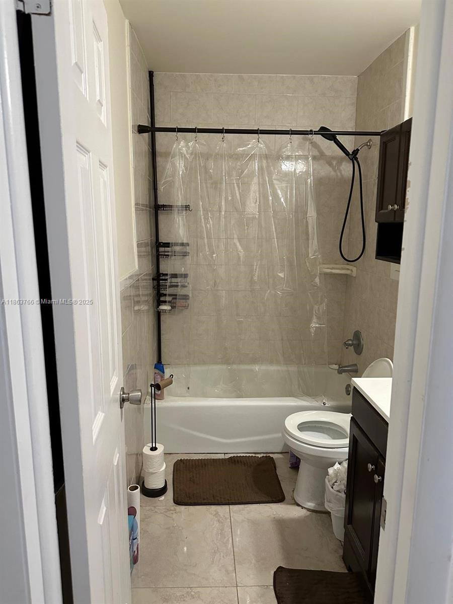 11208 Southwest 67th Terrace Miami, FL 33173 - Photo 17 of 33 a bathroom with a sink toilet and shower