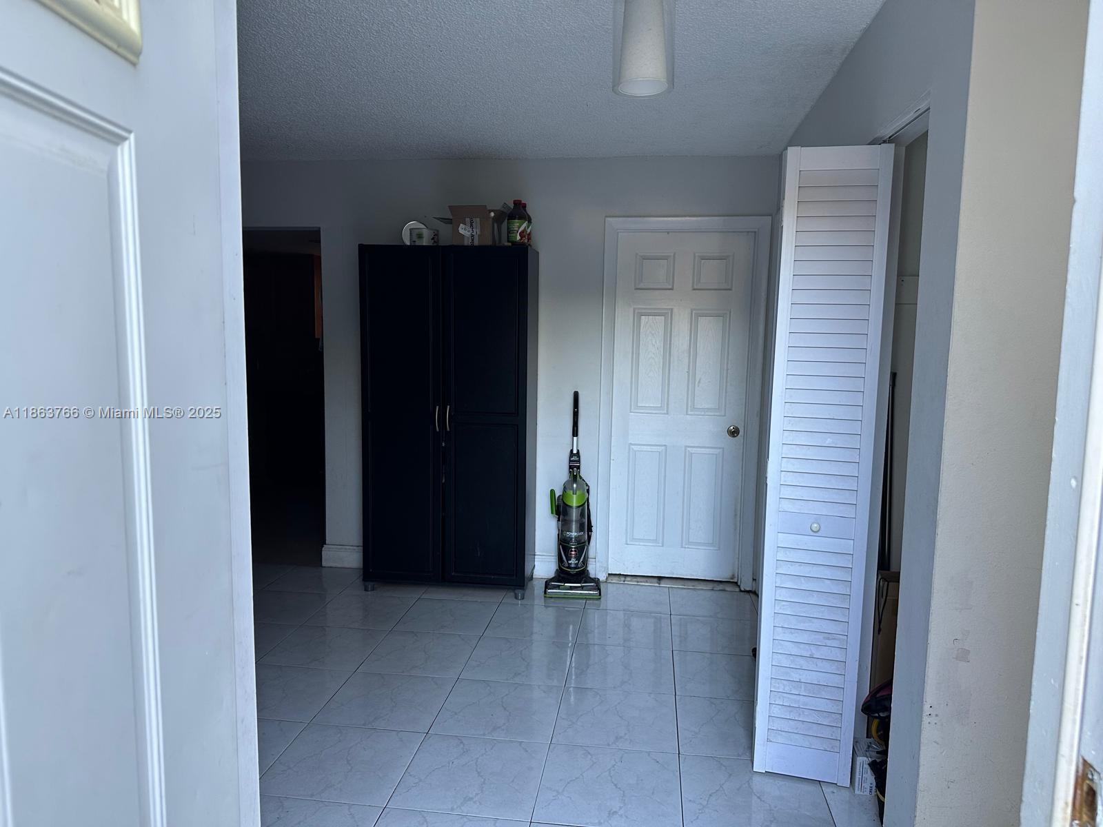 11208 Southwest 67th Terrace Miami, FL 33173 - Photo 18 of 33 a view of an empty room