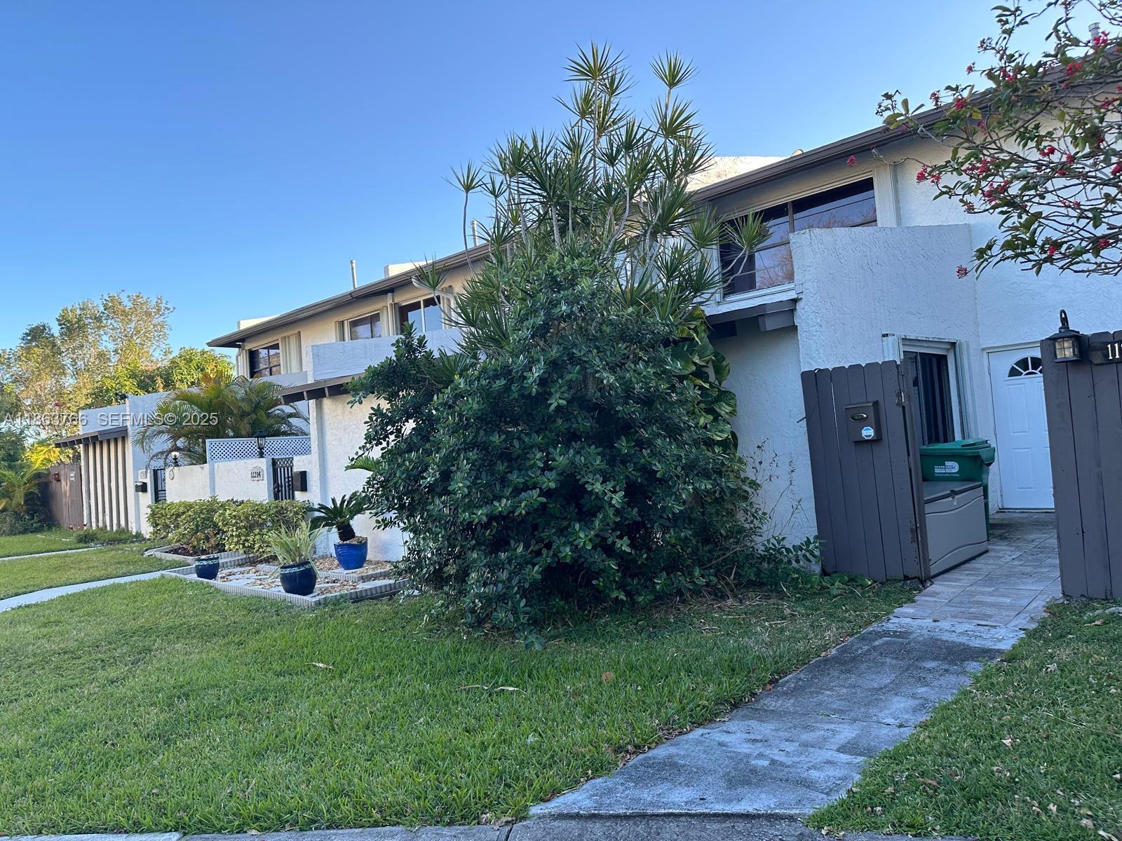 11208 Southwest 67th Terrace Miami, FL 33173 - Photo 19 of 33 a front view of a house with garden