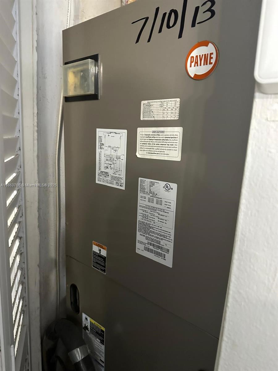 11208 Southwest 67th Terrace Miami, FL 33173 - Photo 20 of 33 a view of a hallway with paintings on the wall