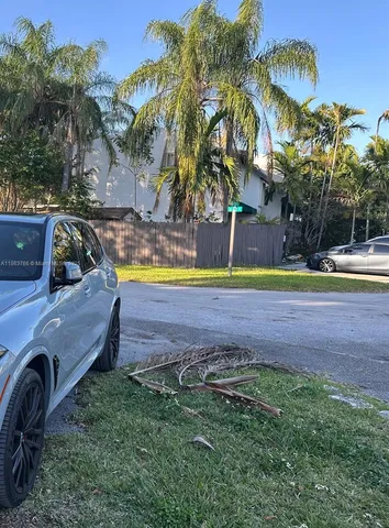 a kitchen with a sink a counter and wooden cabinets