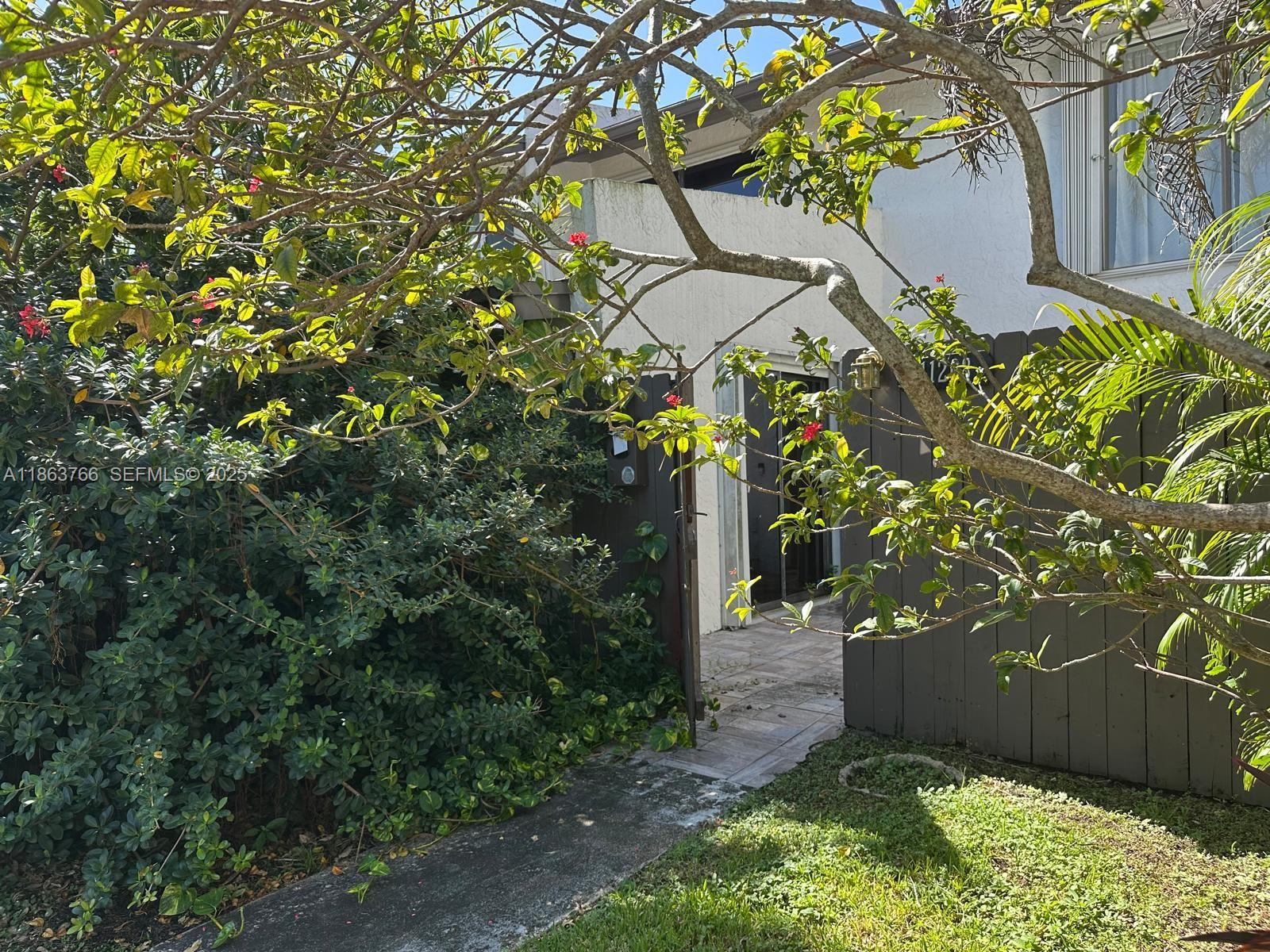 11208 Southwest 67th Terrace Miami, FL 33173 - Photo 33 of 33 a view of a tree in front of a house