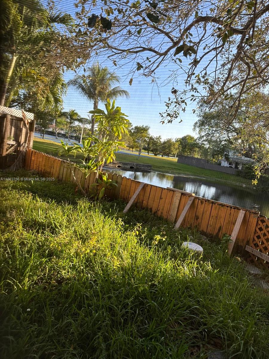 11208 Southwest 67th Terrace Miami, FL 33173 - Photo 5 of 33 a view of a lake with a house in the background
