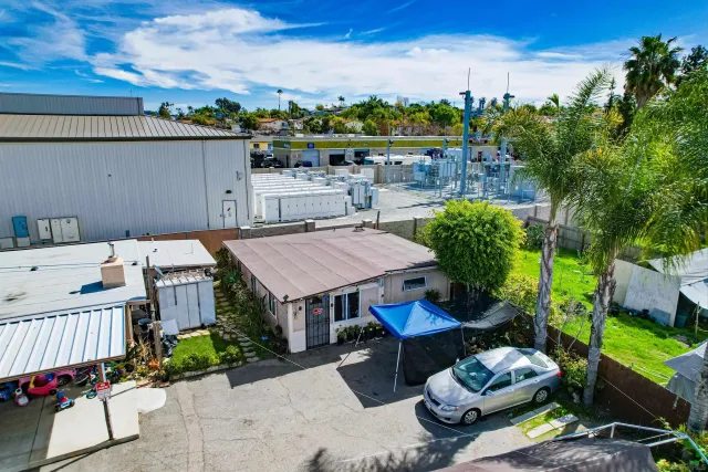 an aerial view of a house with swimming pool garden and patio