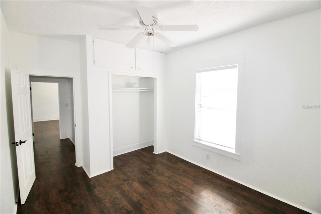 610 Dundee Road, Unit 1 Dundee, FL 33838 - Photo 14 of 28 an empty room with wooden floor and a window