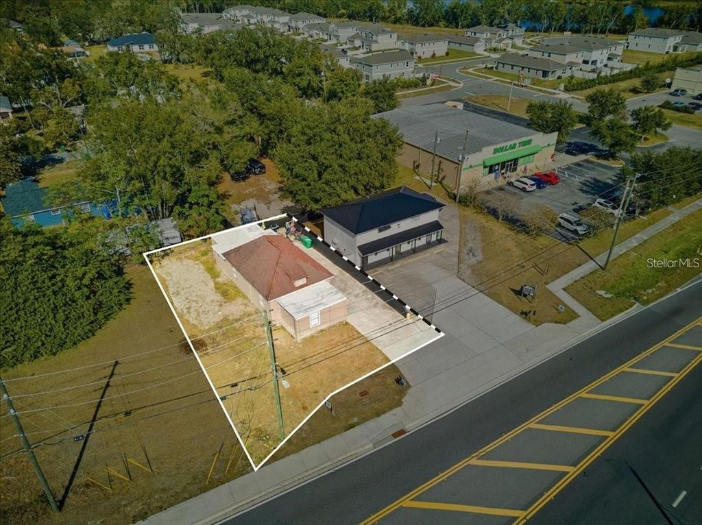 610 Dundee Road, Unit 1 Dundee, FL 33838 - Photo 24 of 28 a view of a tennis ground with large trees