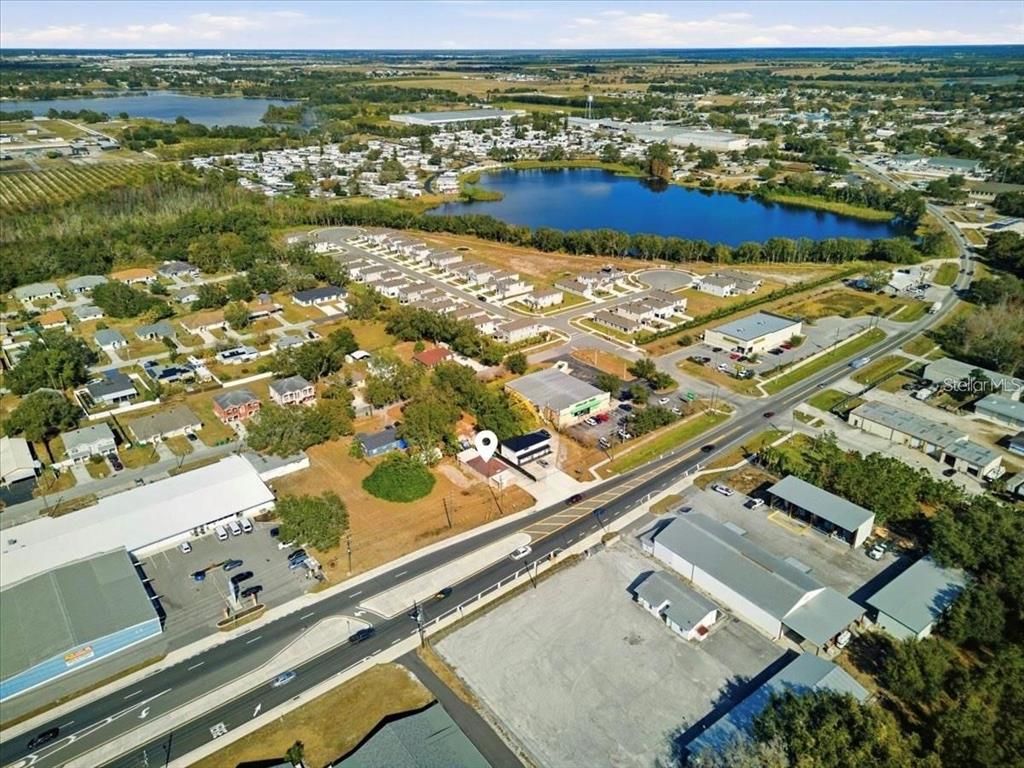 610 Dundee Road, Unit 1 Dundee, FL 33838 - Photo 4 of 28 an aerial view of residential houses with outdoor space