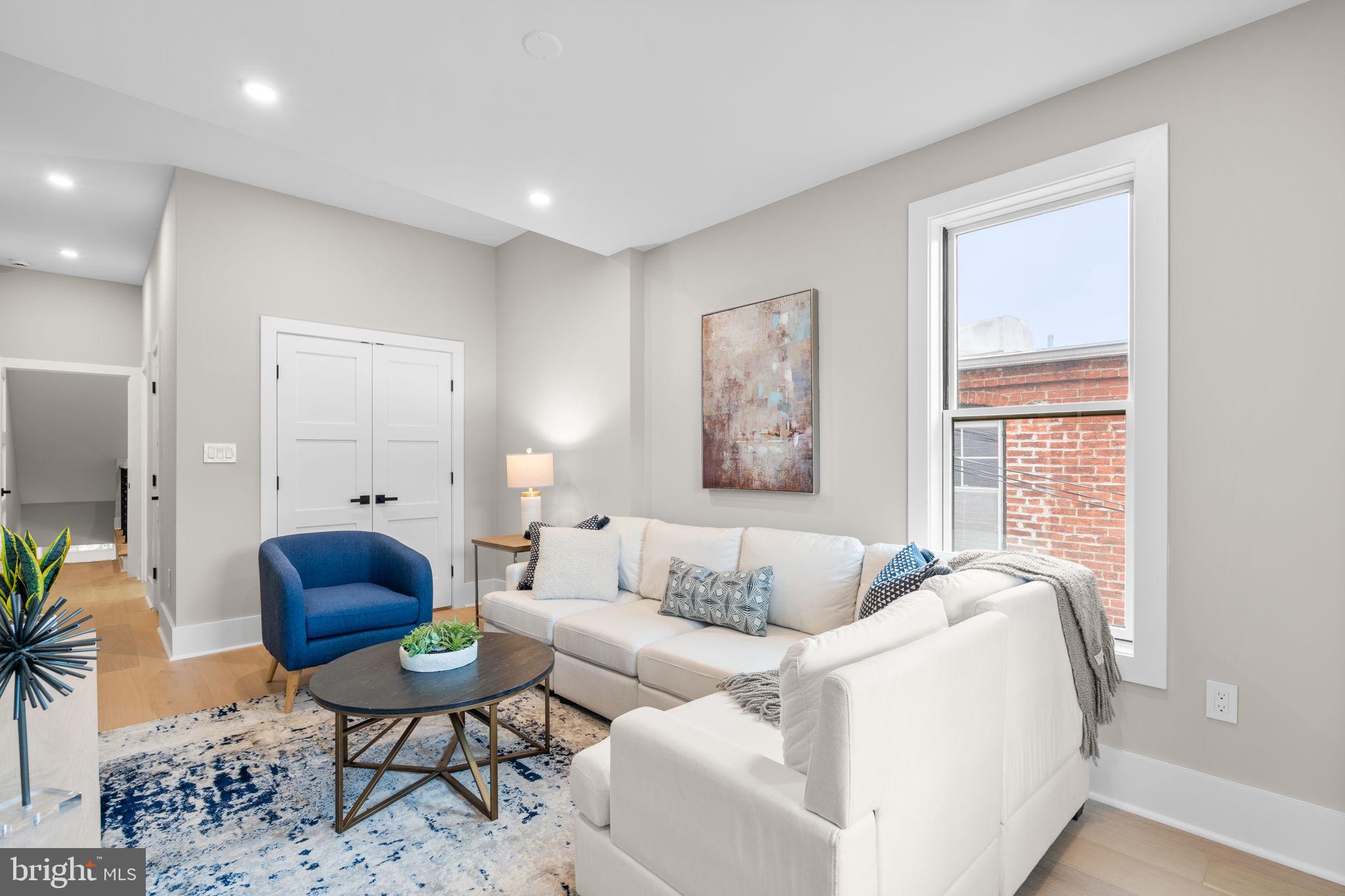 1816 13th Street Northwest Washington, DC 20009 - Photo 16 of 30 a living room with furniture and a large window