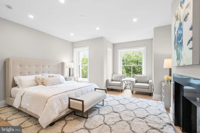 a bedroom with a bed and a couch