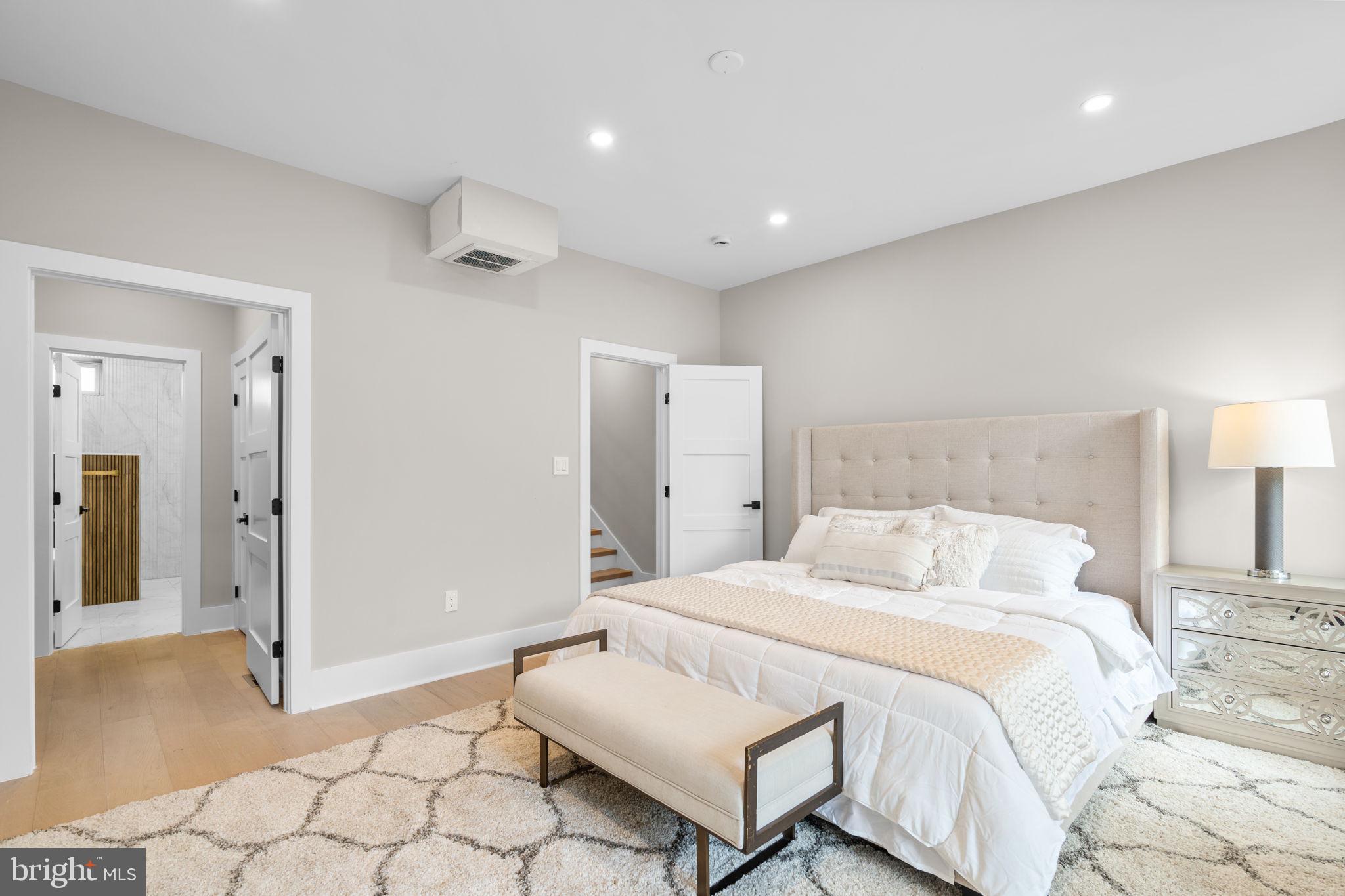 1816 13th Street Northwest Washington, DC 20009 - Photo 20 of 30 a bedroom with a bed and a lamp