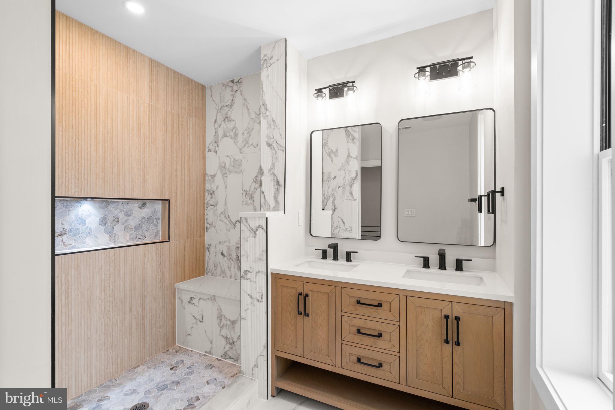 1816 13th Street Northwest Washington, DC 20009 - Photo 24 of 30 a bathroom with a double vanity sink a mirror and a