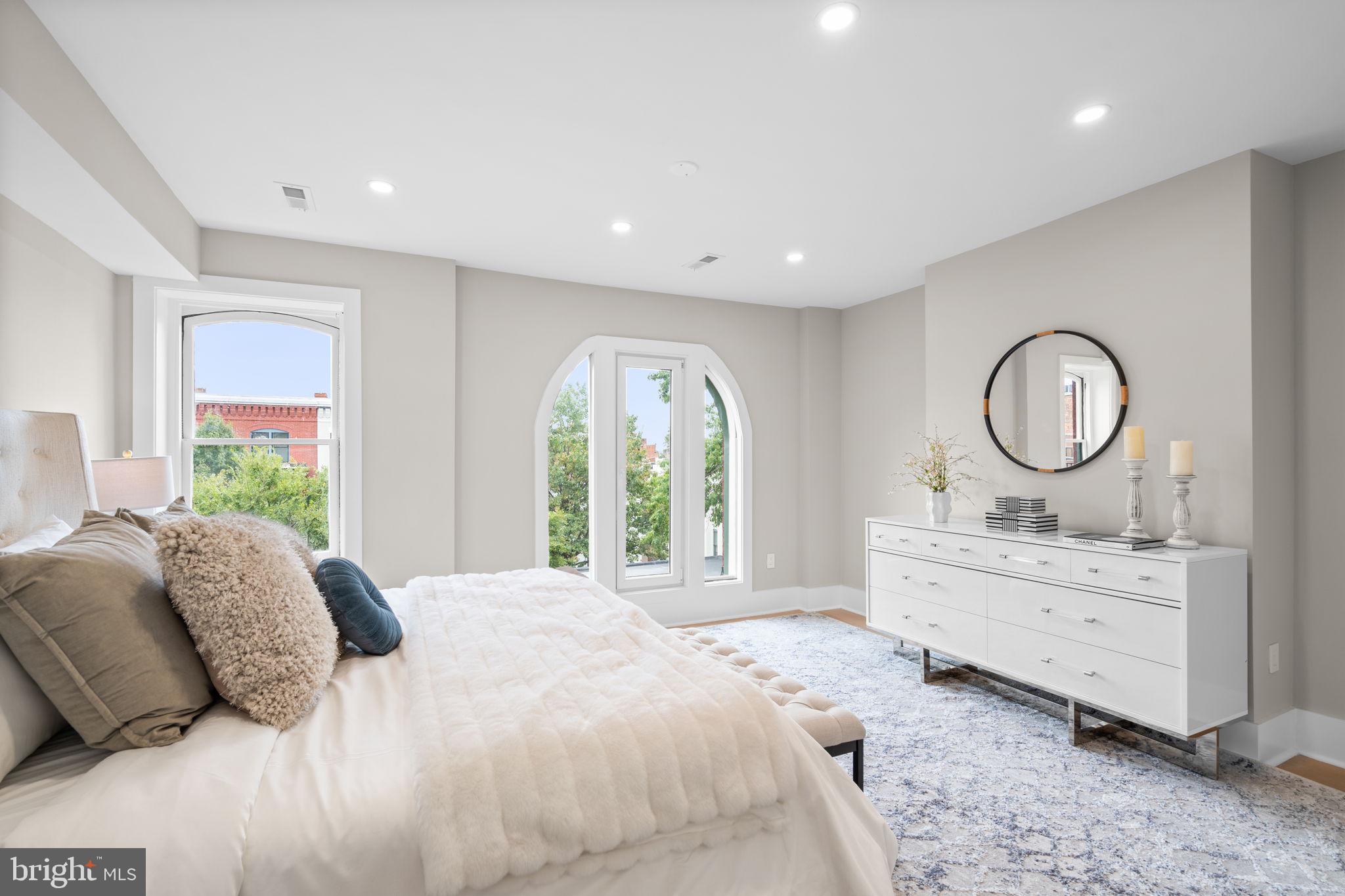 1816 13th Street Northwest Washington, DC 20009 - Photo 25 of 30 a bed room with a bed mirror and a window