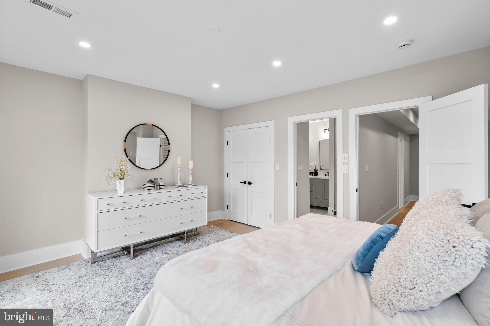 1816 13th Street Northwest Washington, DC 20009 - Photo 27 of 30 a bedroom with a bed and a mirror