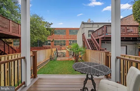 a view of a deck with couches table and chairs