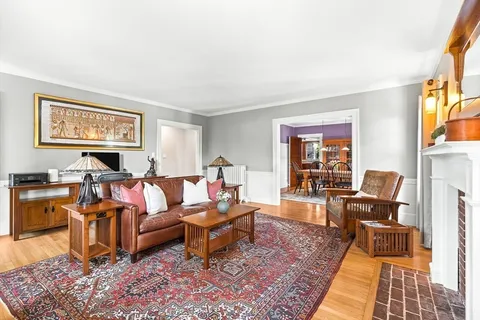 a living room with furniture and a rug