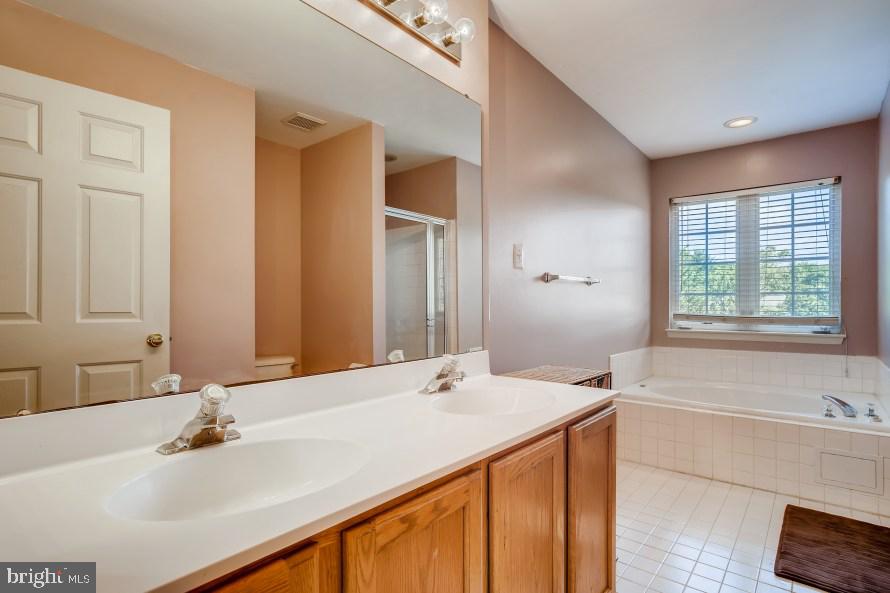 316 Spry Island Road Joppa, MD 21085 - Photo 18 of 33 Primary bathroom with soaking tub and sep shower