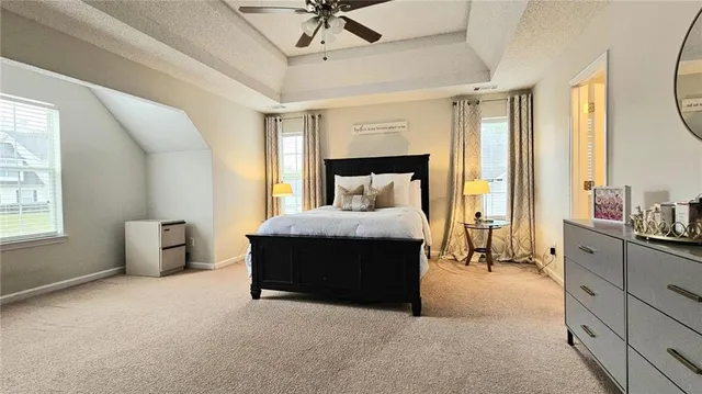 a bed room with a bed and a chair