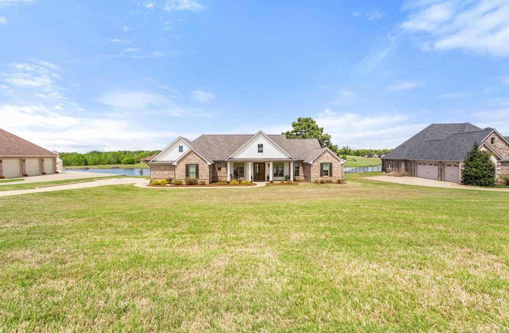 23630 Champion Drive Lindale, TX 75771 - Photo 1 of 36 a front view of a house with a big yard