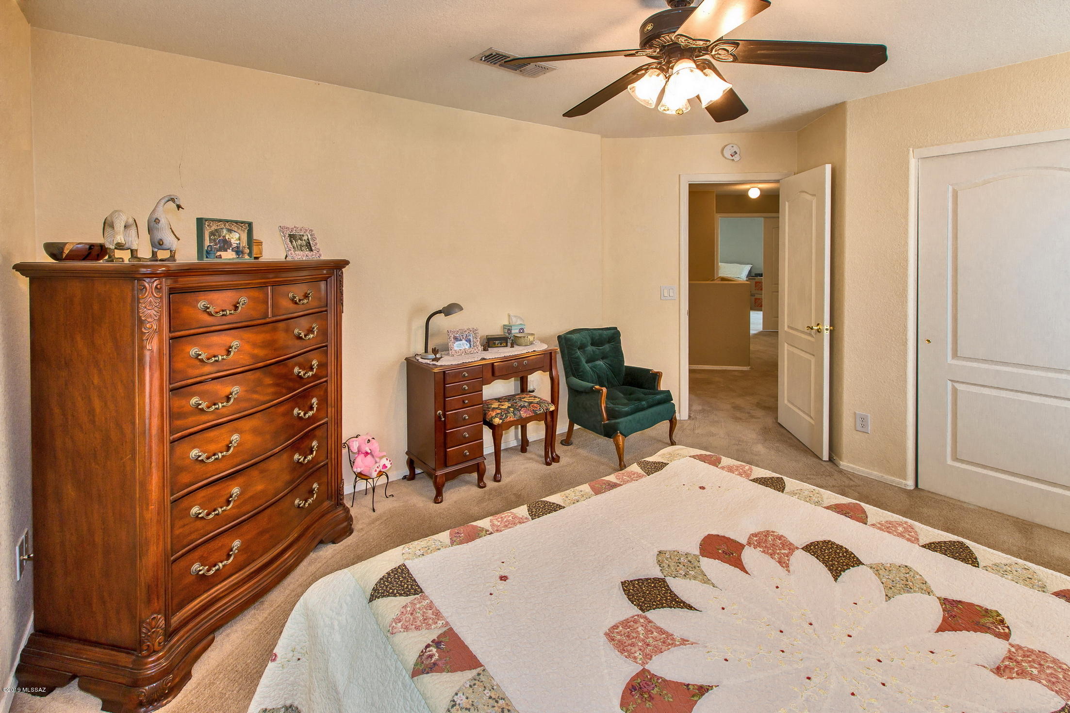 3600 East Mecate Road Tucson, AZ 85739 - Photo 34 of 39 a bed room with a bed and a dresser