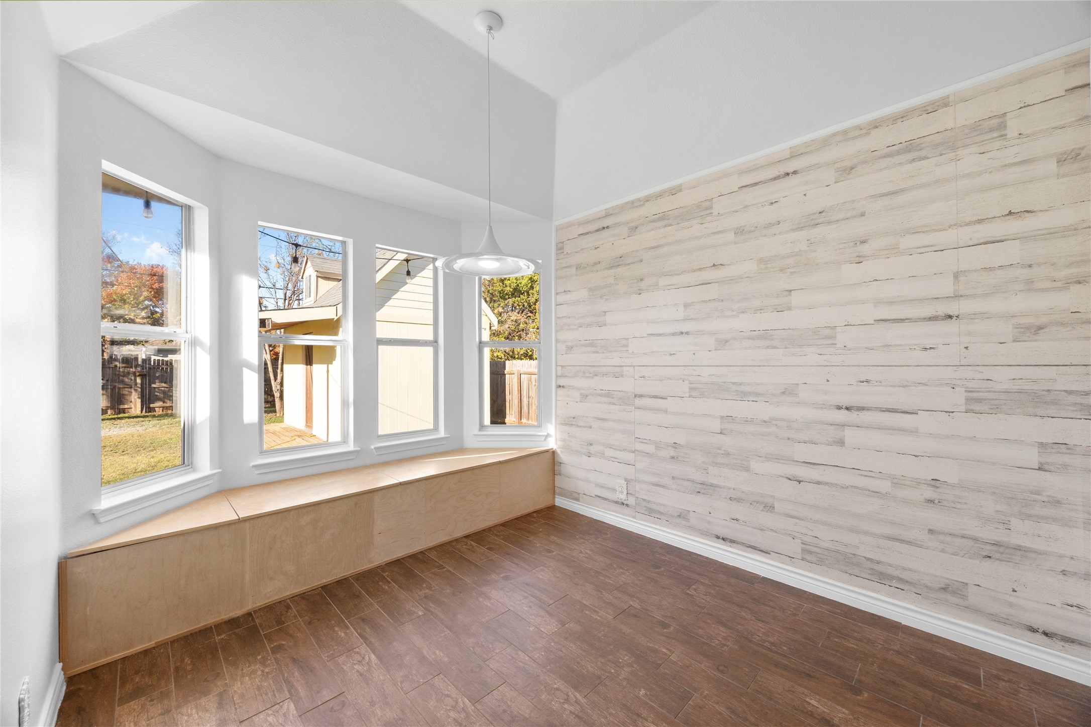 811 Lantana Lane Leander, TX 78641 - Photo 12 of 25 Breakfast nook with shiplap accent wall and bay windows.