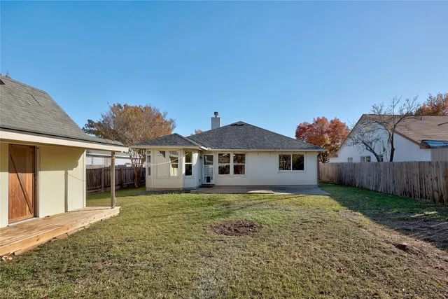a utility room with sink and lots of washer