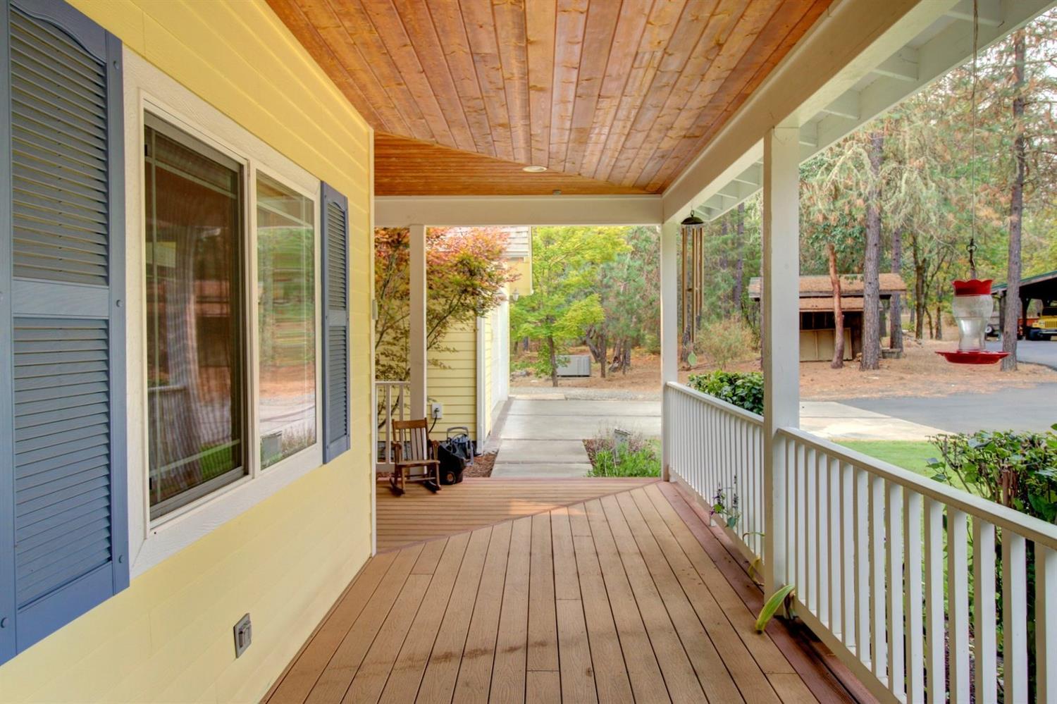 1065 Riessen Road Grants Pass, OR 97526 - Photo 26 of 32 a view of a porch with wooden floor and floor to ceiling window