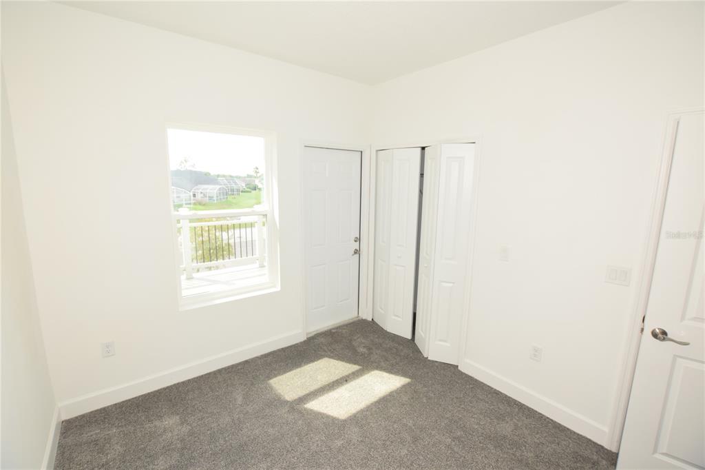 460 Lake Shore Parkway Davenport, FL 33896 - Photo 13 of 27 a view of an empty room with a window