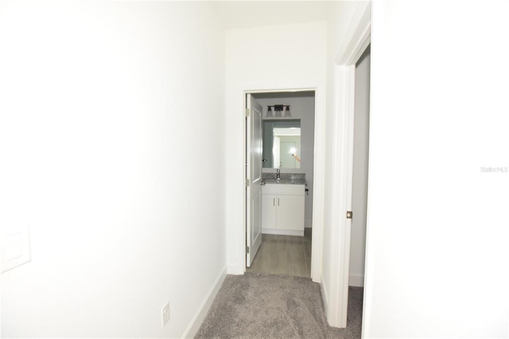460 Lake Shore Parkway Davenport, FL 33896 - Photo 14 of 27 a view of a bathroom from a hallway