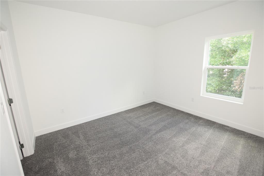 460 Lake Shore Parkway Davenport, FL 33896 - Photo 22 of 27 an empty room with a window