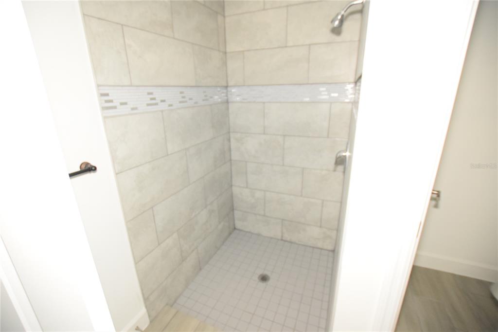 460 Lake Shore Parkway Davenport, FL 33896 - Photo 27 of 27 a bathroom with a shower