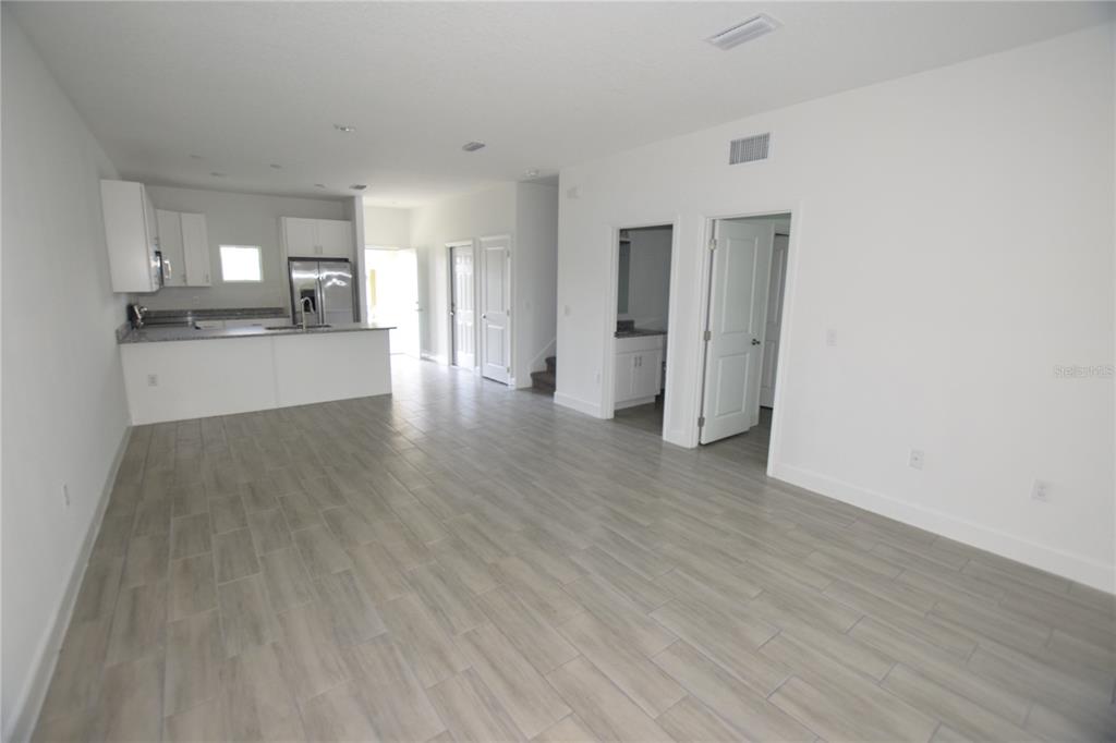 460 Lake Shore Parkway Davenport, FL 33896 - Photo 6 of 27 a view of a kitchen with a sink and a refrigerator