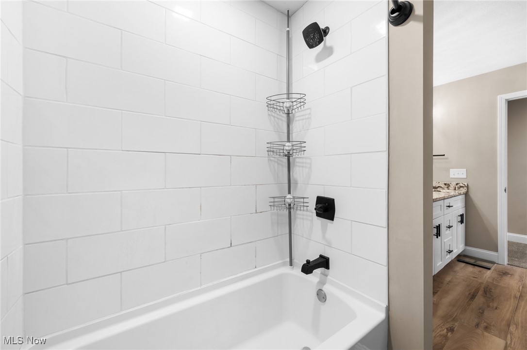 39600 Aurora Road Solon, OH 44139 - Photo 32 of 49 Full bath featuring double vanity and baseboards