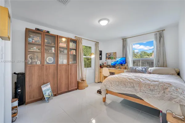 a bedroom with a bed and a table