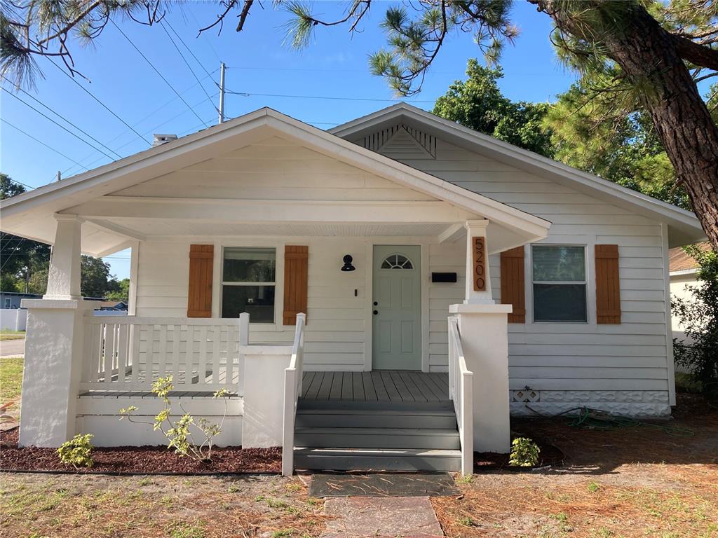 a front view of a house with stairs