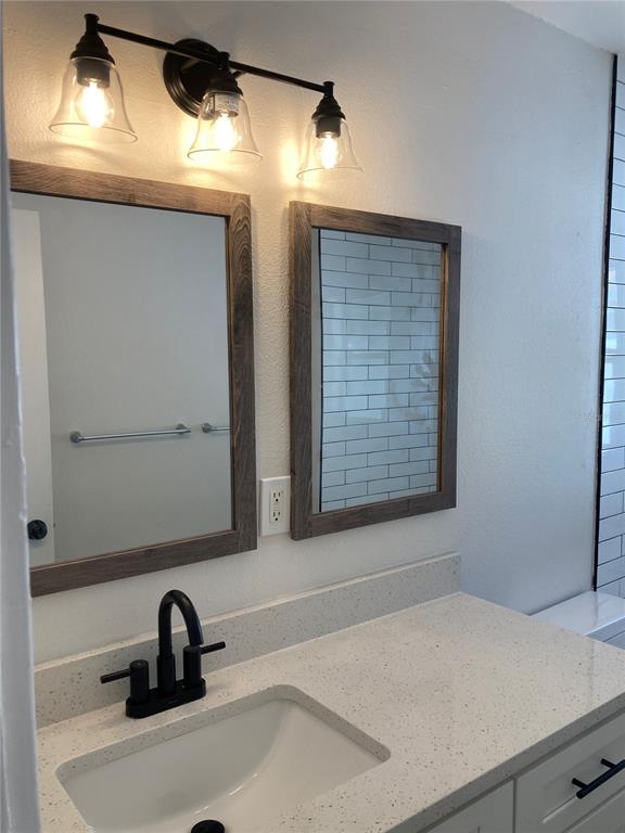 5200 3rd Avenue South St. Petersburg, FL 33707 - Photo 14 of 47 a bathroom with a sink and a window