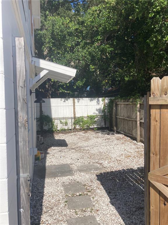 5200 3rd Avenue South St. Petersburg, FL 33707 - Photo 18 of 47 a backyard of a house with a fountain