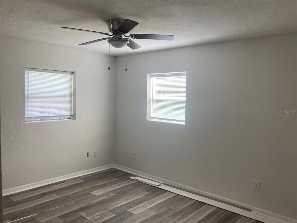 5200 3rd Avenue South St. Petersburg, FL 33707 - Photo 21 of 47 an empty room with a window and a fan
