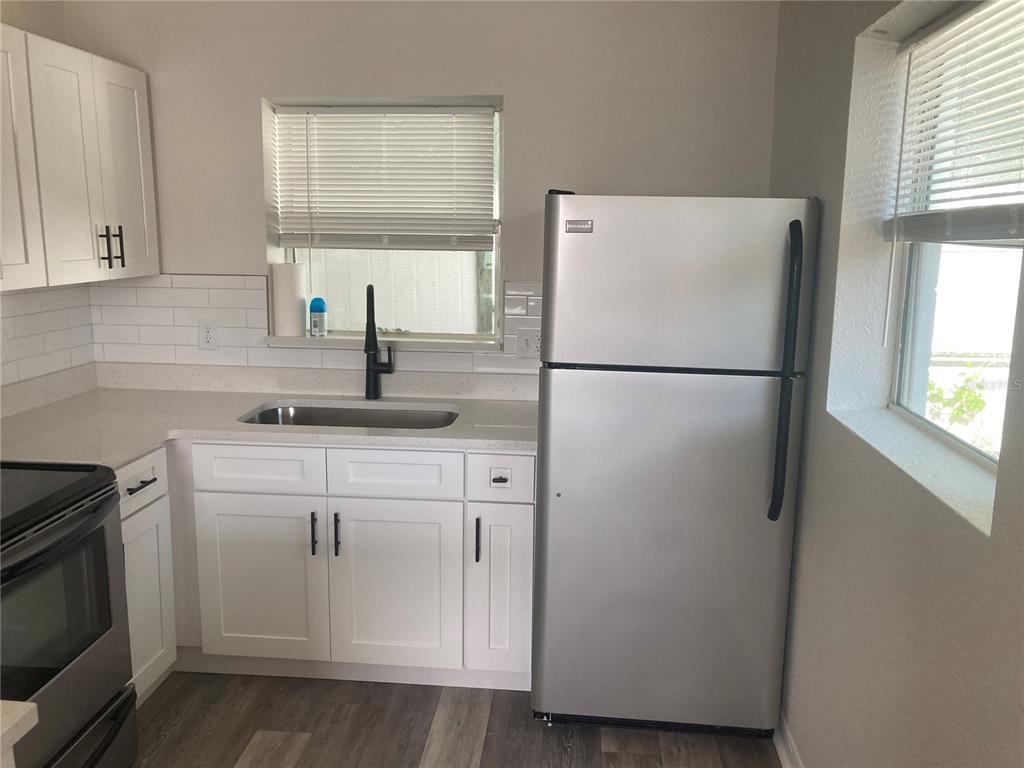 5200 3rd Avenue South St. Petersburg, FL 33707 - Photo 24 of 47 a white refrigerator freezer sitting in a kitchen