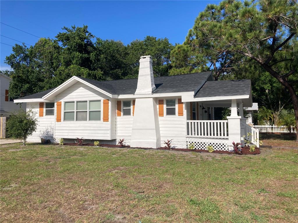 5200 3rd Avenue South St. Petersburg, FL 33707 - Photo 3 of 47 a front view of a house with a yard