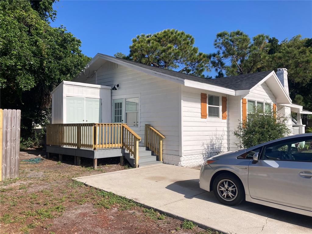 5200 3rd Avenue South St. Petersburg, FL 33707 - Photo 4 of 47 a front view of a house with parking space